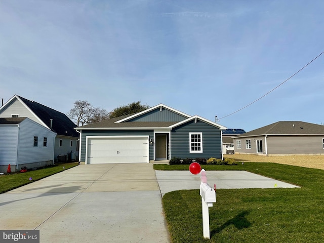 view of front of property with a front lawn and a garage