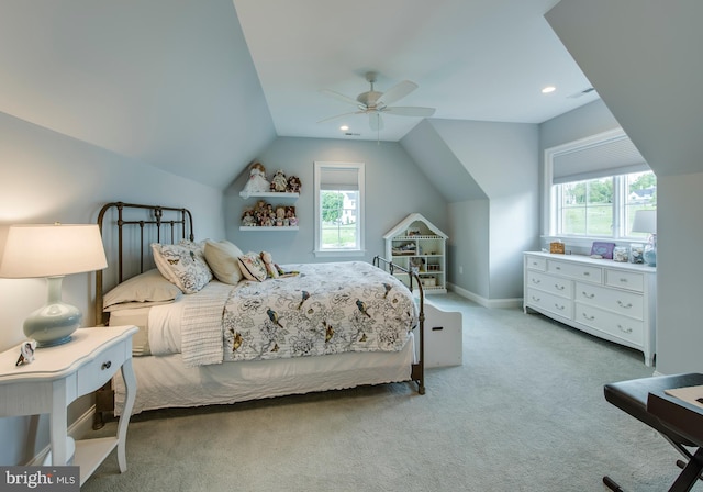 bedroom featuring carpet flooring, vaulted ceiling, and ceiling fan