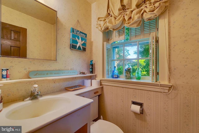 bathroom featuring vanity and toilet