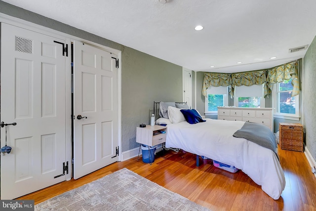 bedroom with light wood-type flooring