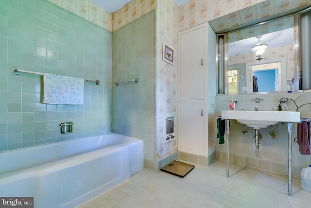 bathroom featuring a washtub and tile patterned floors