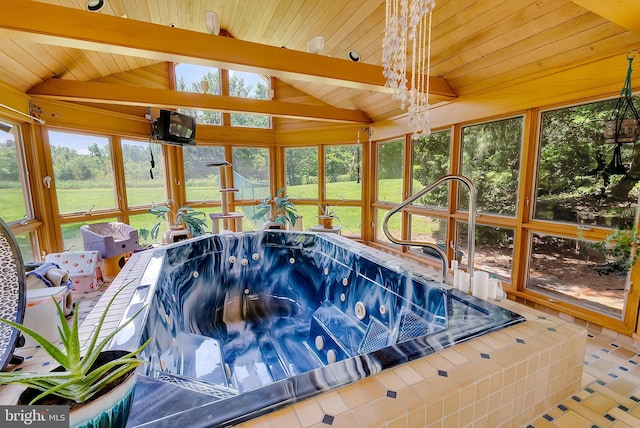 view of swimming pool featuring an indoor hot tub