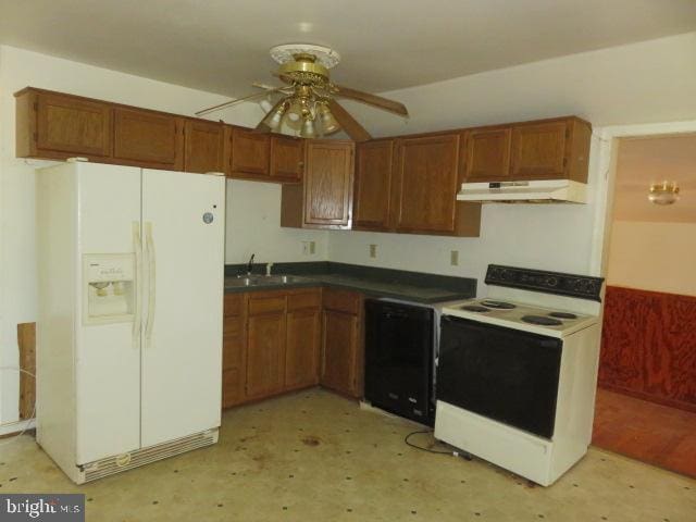 kitchen with white appliances, ceiling fan, and sink