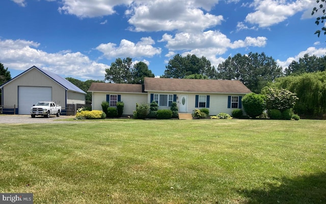 ranch-style home with a garage, an outdoor structure, and a front lawn