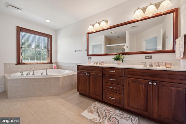 bathroom featuring tile patterned floors, plus walk in shower, and vanity