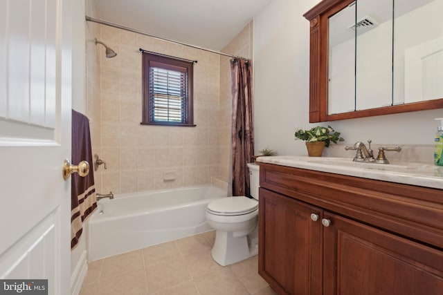 full bathroom featuring tile patterned flooring, vanity, toilet, and shower / tub combo