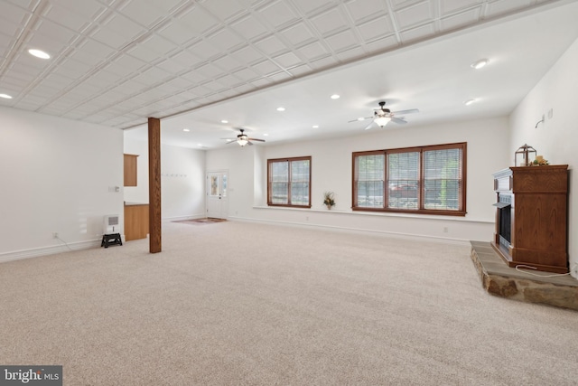 unfurnished living room with ceiling fan and light colored carpet