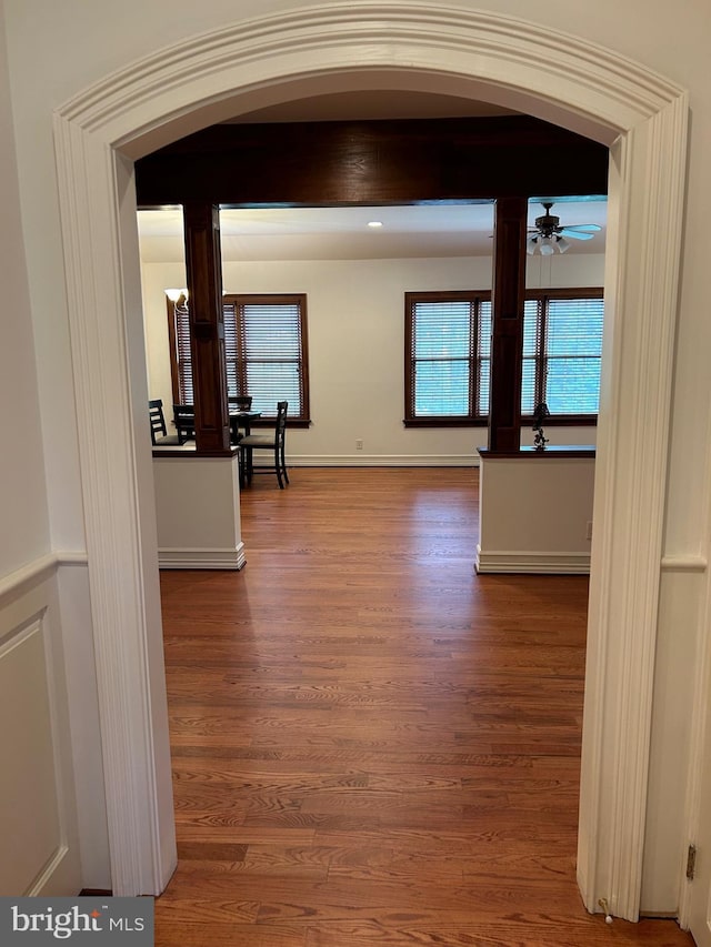 hallway with wood-type flooring