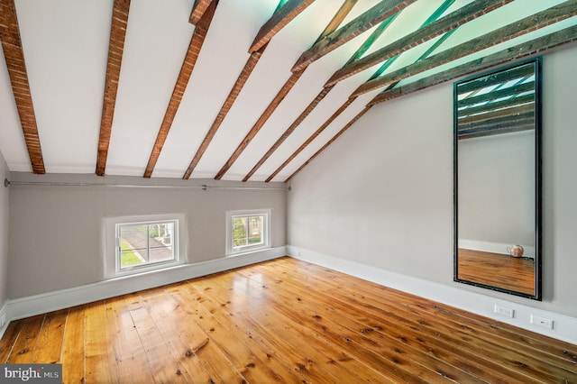 bonus room with vaulted ceiling with beams and hardwood / wood-style floors