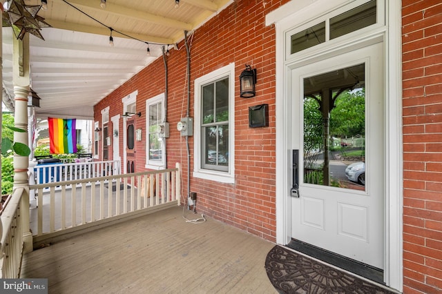 doorway to property featuring a porch