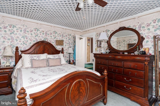 bedroom with ceiling fan and light carpet