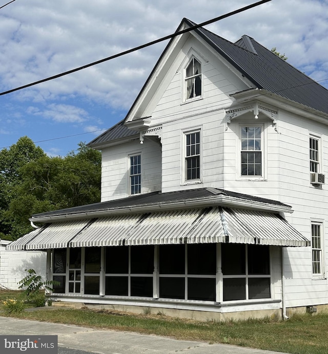 605 State St, Sharptown, MD 21861 - back of property with a sunroom, a metal roof, and cooling unit
