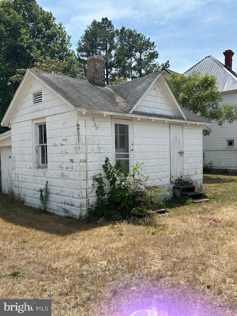 view of property exterior featuring a yard