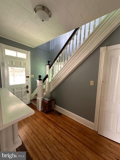605 State St, Sharptown, MD 21861 - foyer entrance featuring stairs and wood-type flooring