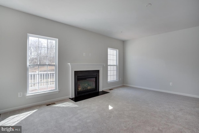 unfurnished living room with light carpet