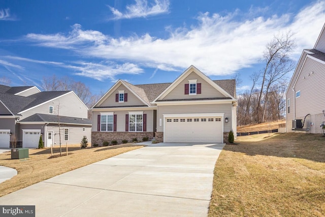 craftsman-style house featuring a front yard and a garage