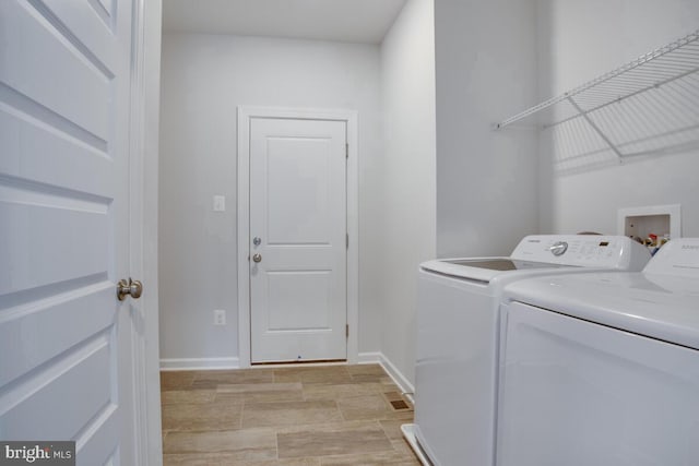 laundry area featuring washing machine and dryer