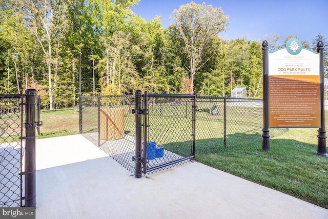 view of gate featuring a yard