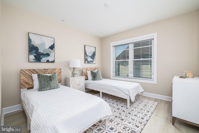 bedroom with light hardwood / wood-style floors