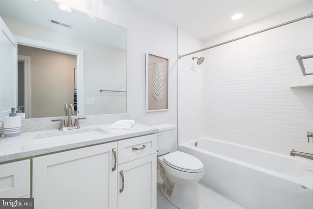 full bathroom with tile patterned floors, tiled shower / bath, vanity, and toilet