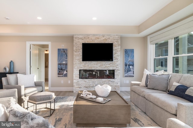 living room with a fireplace and hardwood / wood-style floors