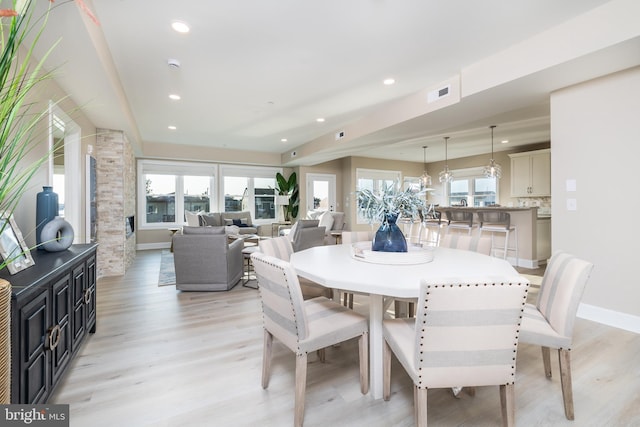 dining area featuring light wood-type flooring