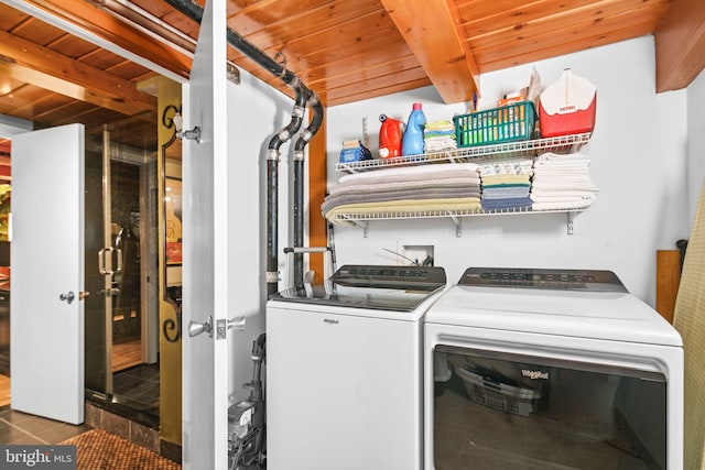 laundry area featuring wood ceiling and independent washer and dryer