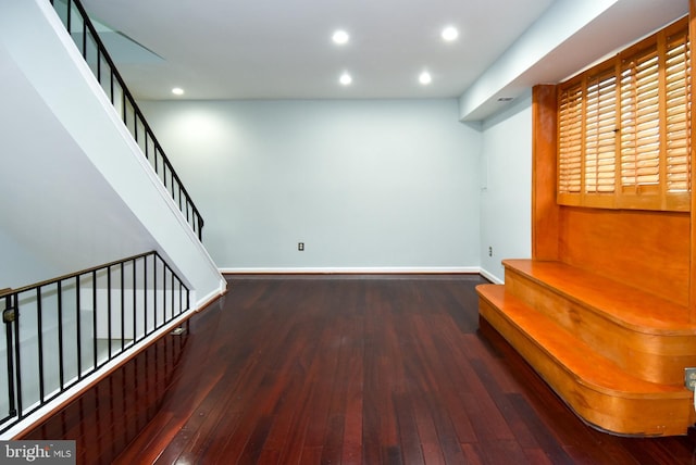 hall with dark hardwood / wood-style flooring