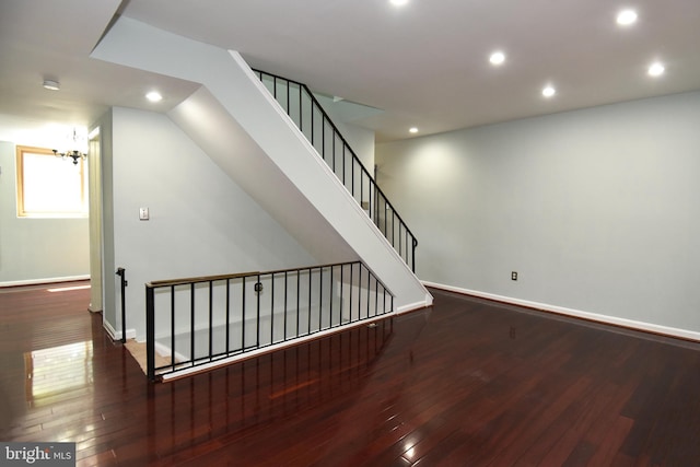 staircase featuring wood-type flooring