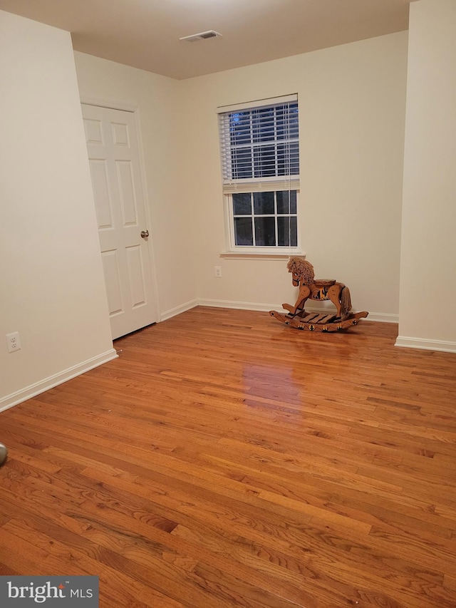 spare room featuring light hardwood / wood-style floors