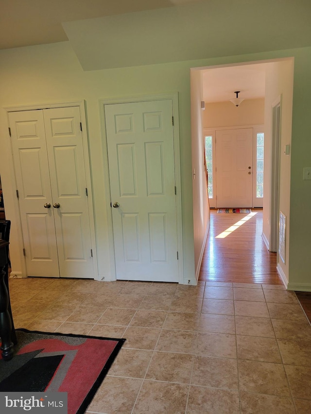 entrance foyer featuring light tile patterned floors