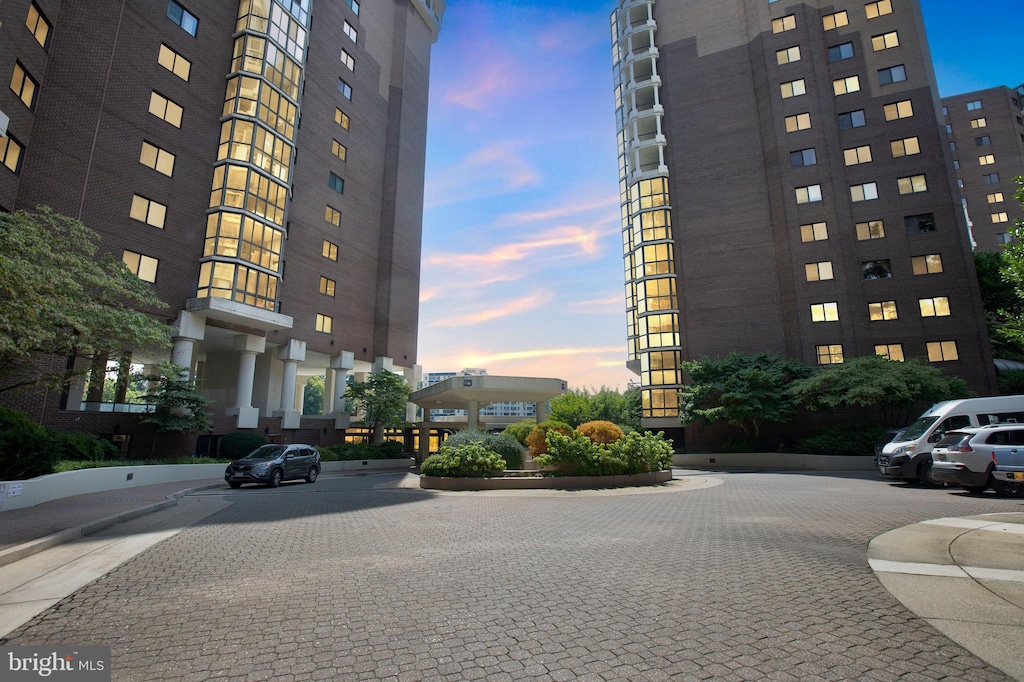 view of outdoor building at dusk