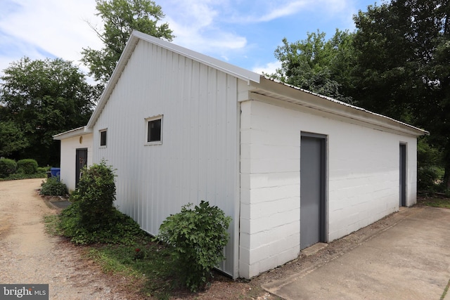 view of home's exterior with an outdoor structure