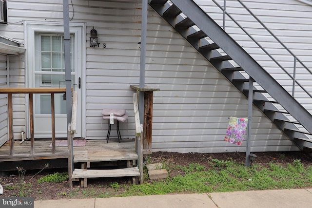 doorway to property with a wooden deck