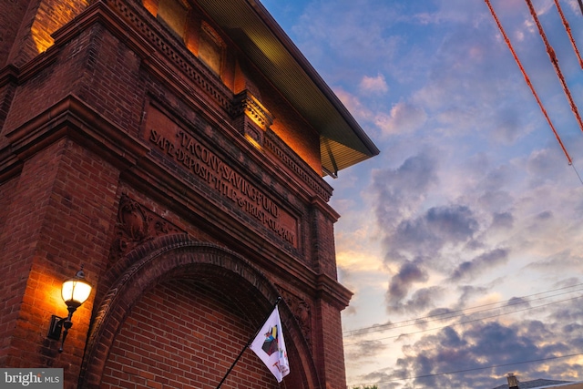 view of outdoor building at dusk