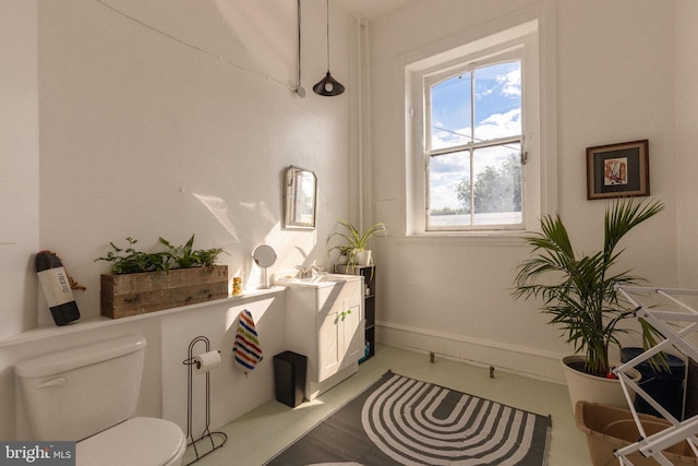 bathroom featuring vanity and toilet