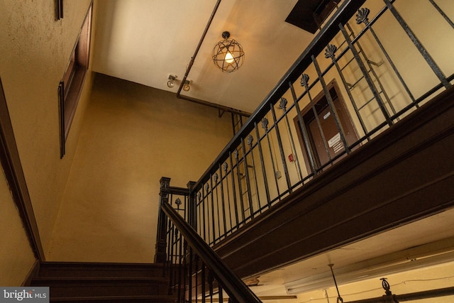 staircase with a towering ceiling