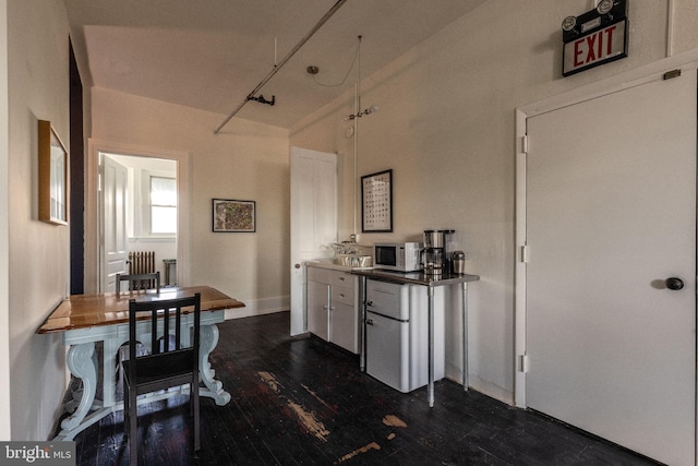 kitchen with white cabinets and dark hardwood / wood-style floors