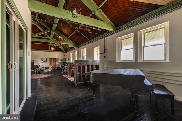 interior space with wood-type flooring, vaulted ceiling with beams, and wooden ceiling