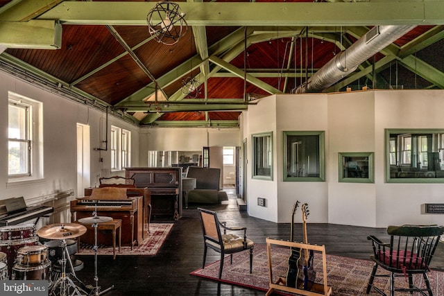 interior space with wood-type flooring, high vaulted ceiling, and a wealth of natural light