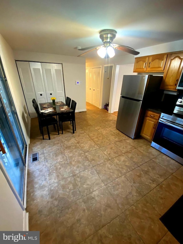 7200 Havre Turn Turn, Upper Marlboro, MD 20772 - kitchen featuring appliances with stainless steel finishes, a ceiling fan, dark countertops, and tile patterned floors