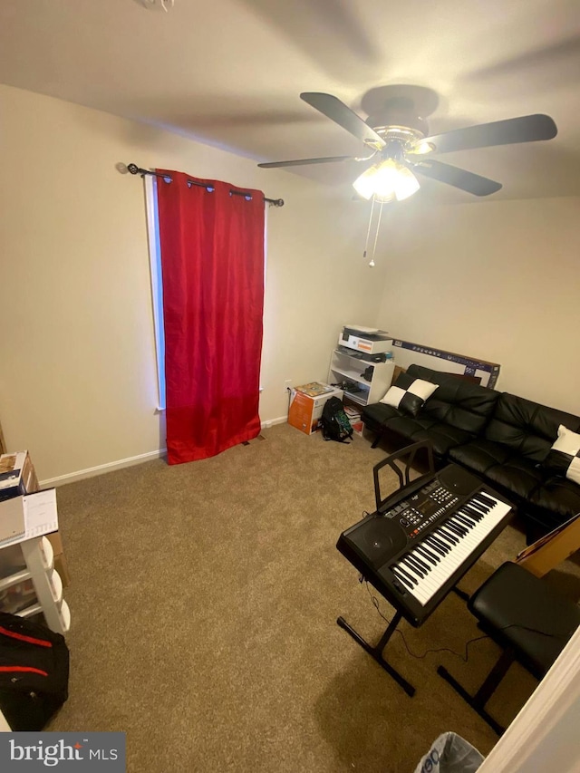 misc room featuring carpet and ceiling fan