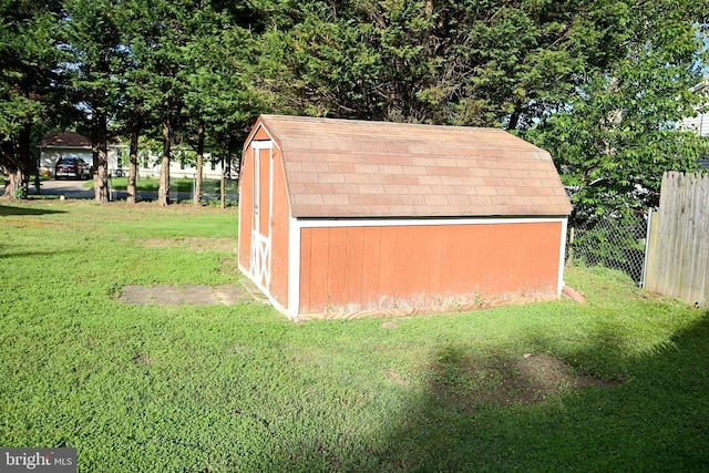 view of outdoor structure with a lawn