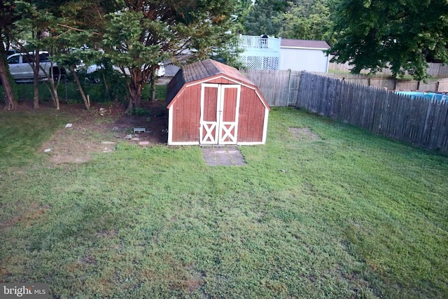 view of outbuilding with a yard