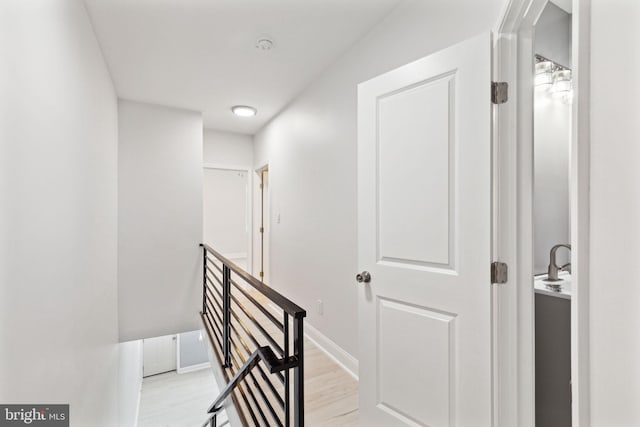 corridor with light wood-type flooring