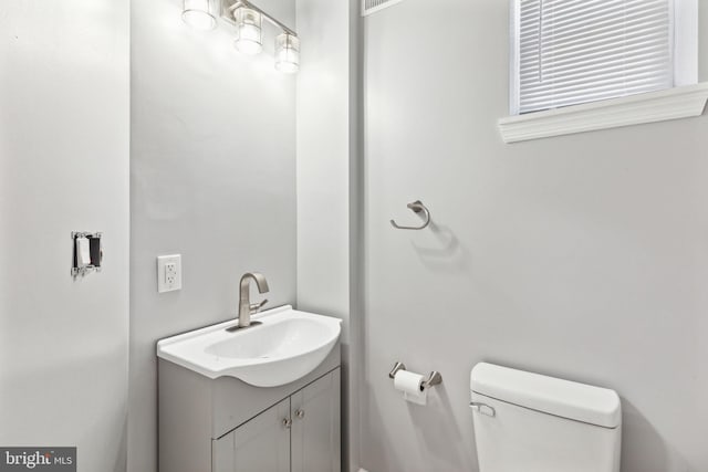 bathroom with vanity and toilet