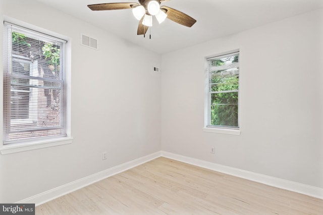 unfurnished room featuring ceiling fan and light wood-type flooring