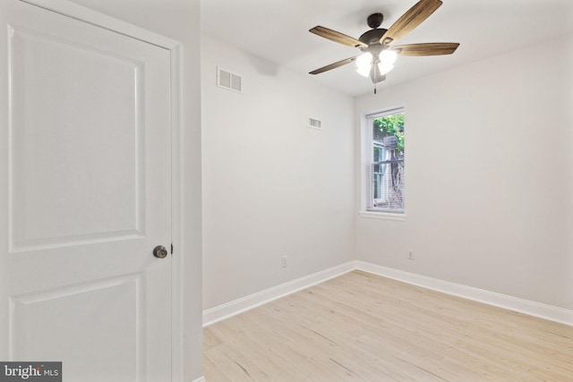 spare room with ceiling fan and light hardwood / wood-style floors