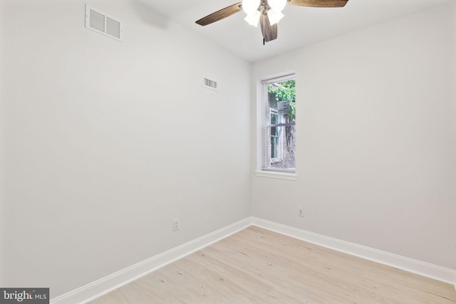 spare room featuring ceiling fan and light hardwood / wood-style flooring