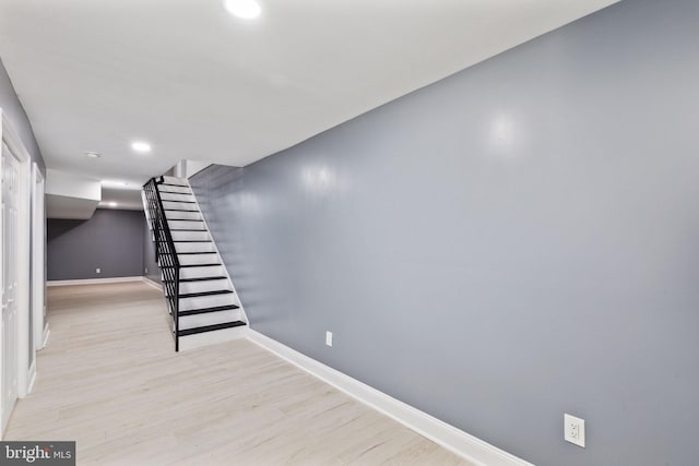 basement featuring light hardwood / wood-style flooring